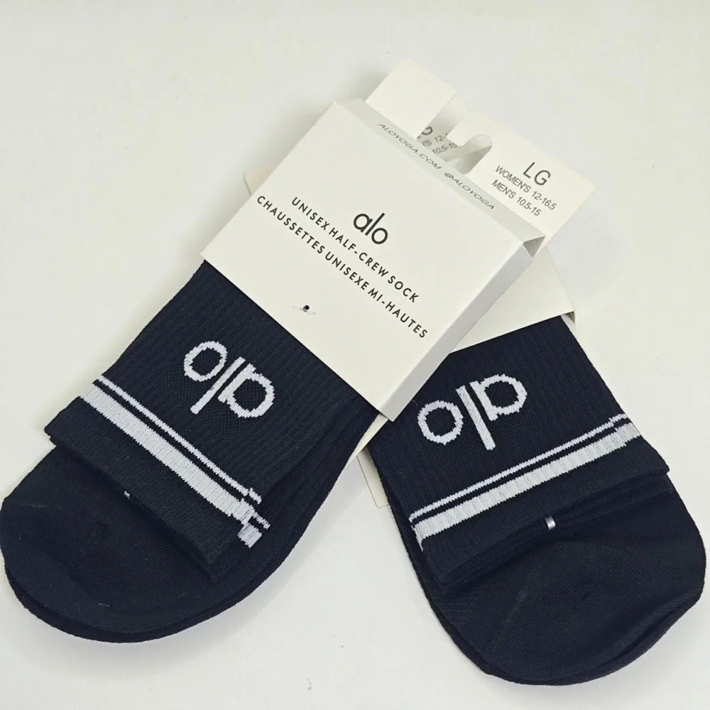 ALO Yoga Black Half-Crew Socks with White Logo and Stripes
